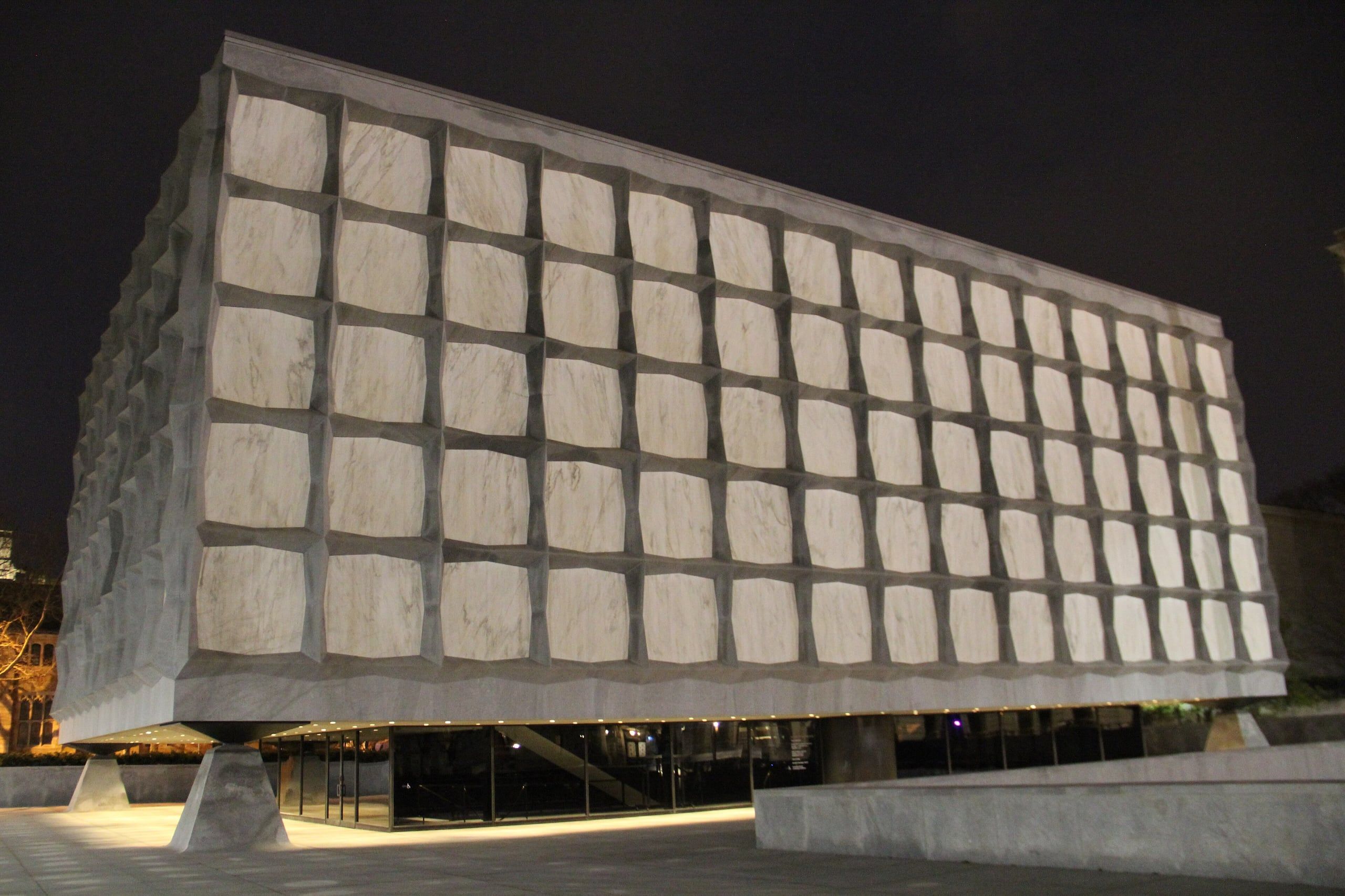 The marble panels of the Beinecke Rare Book Library at Yale, lit from inside at night