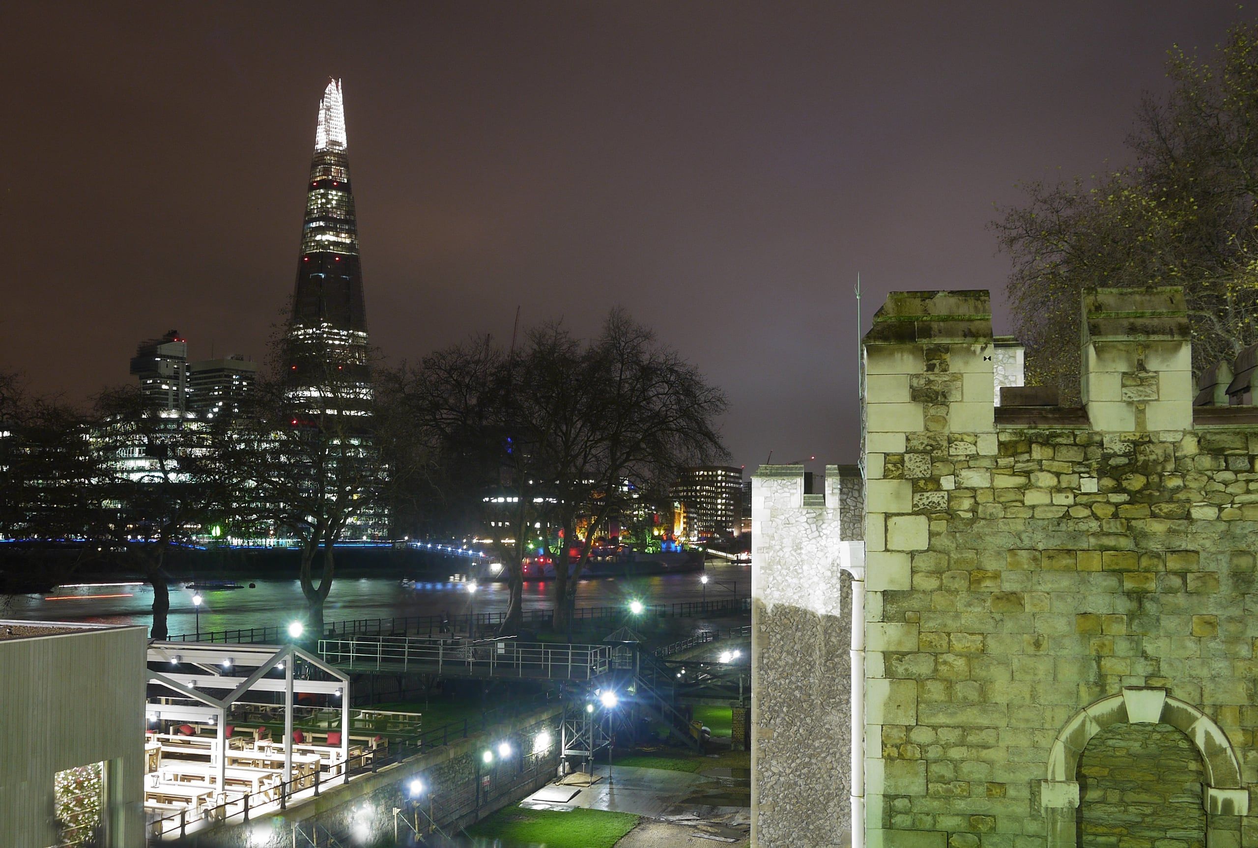 The London skyline at night, lit along the Thames