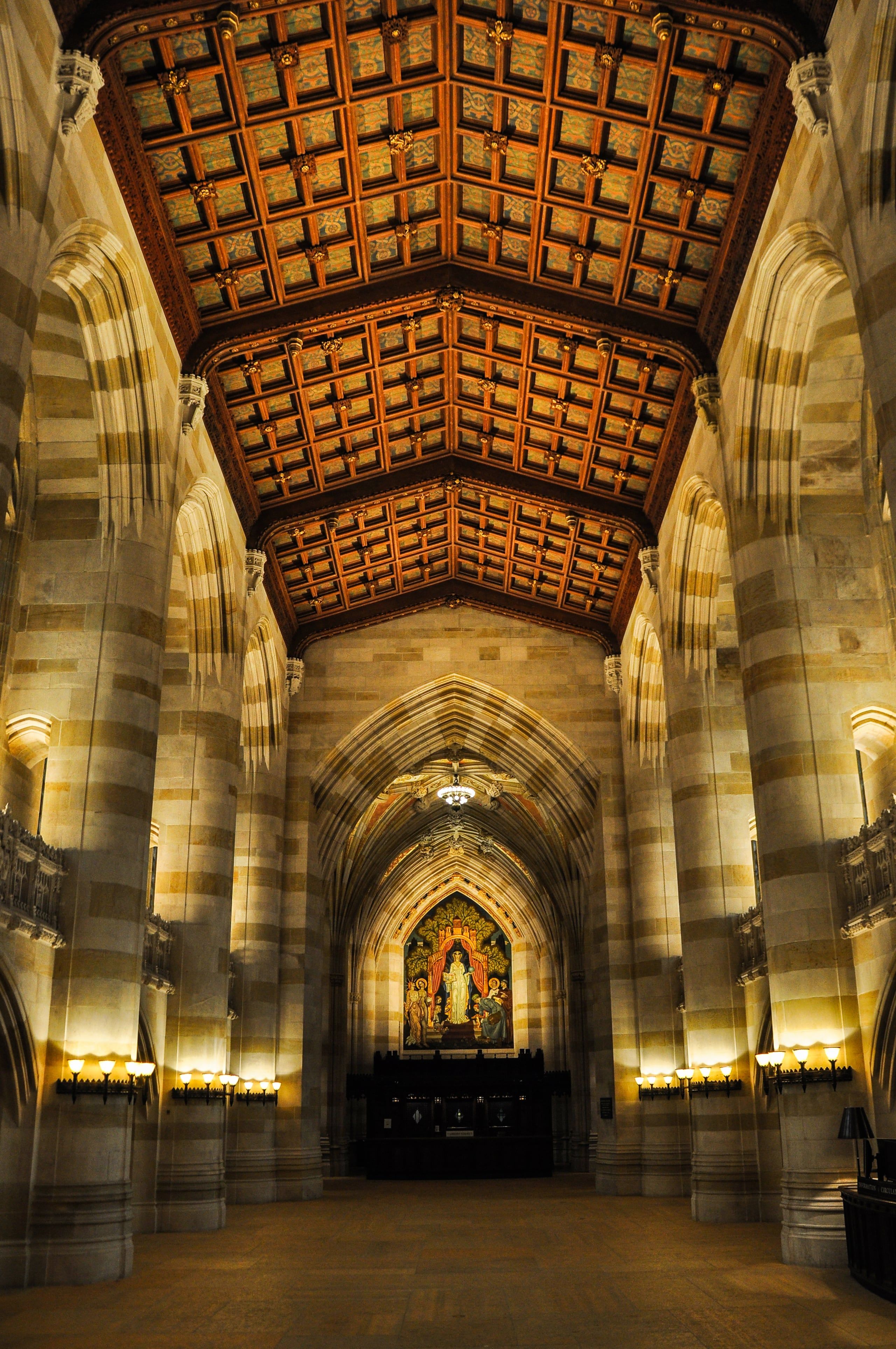 The vaulted nave of Sterling Memorial Library at Yale, lit from its lamps